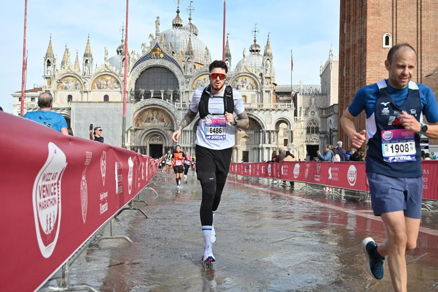 Callum running the Venice Marathon through St Mark's Square