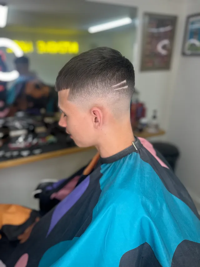 Finished fade with a side hair-line design