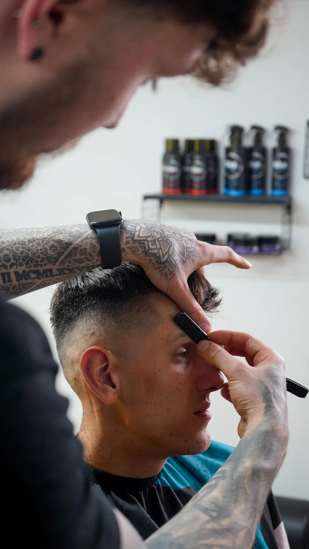 Close detail of a Barber Warnz cut in progress