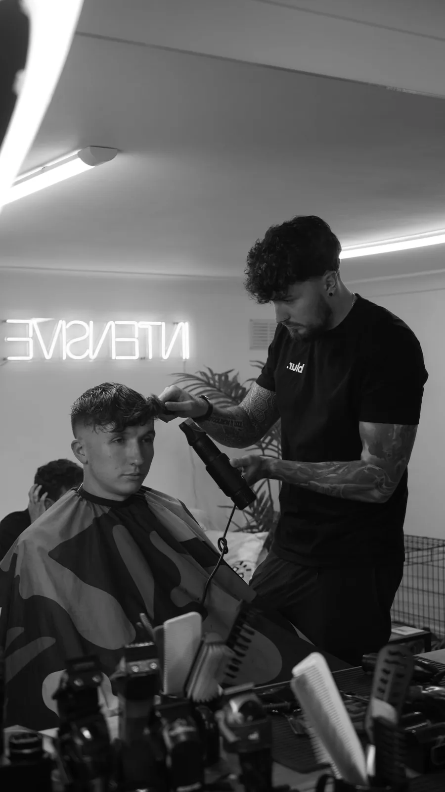 Callum mid-cut, focused on the fade